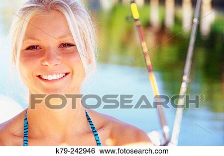 Stock Photograph - Young Woman on Water Smiling. Fotosearch