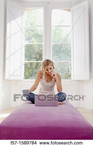 Young woman online View Large Photo Image Picture - Young woman online. Fotosearch