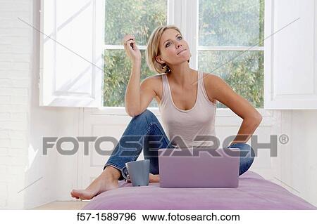 Young woman online shopping View Large Photo Image Stock Photograph - Young woman online shopping. Fotosearch