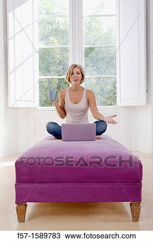 Young woman online View Large Photo Image Stock Image - Young woman online. Fotosearch