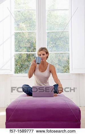 Young woman online View Large Photo Image Stock Photo - Young woman online. Fotosearch