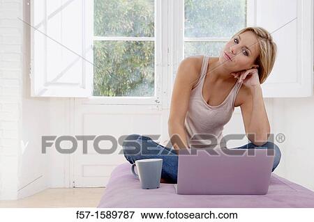Young woman online View Large Photo Image Stock Photo - Young woman online. Fotosearch