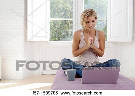Stock Photography - Young woman online. Fotosearch