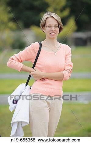 Young woman outdoors View Large Photo Image Stock Photo - Young woman outdoors. Fotosearch