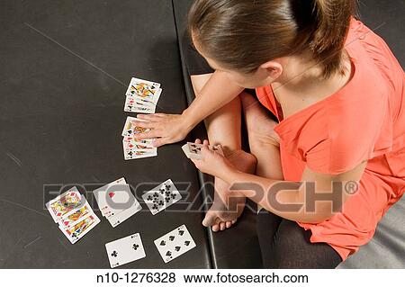 Young woman playing cards View Large Photo Image Stock Photo - Young woman playing cards. Fotosearch