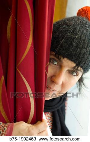 young woman playing hide and seek with happy face View Large Photo Image Stock Image - young woman playing hide and seek with happy face. Fotosearch