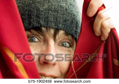 young woman playing hide and seek with happy face View Large Photo Image Stock Photo - young woman playing hide and seek with happy face. Fotosearch