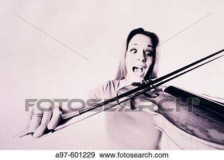 Young woman plays violin View Large Photo Image Stock Photo - Young woman plays violin. Fotosearch