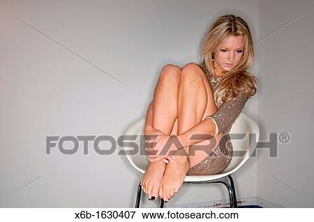 Young woman portrait, 18-25 years, posing in gold sequin party dress View Large Photo Image Stock Photo - Young woman portrait, 18-25 years, posing in gold sequin party dress. Fotosearch