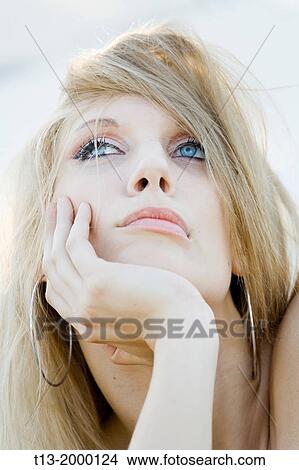 Young woman portrait day-dreaming in the wind View Large Photo Image Picture - Young woman portrait day-dreaming in the wind. Fotosearch
