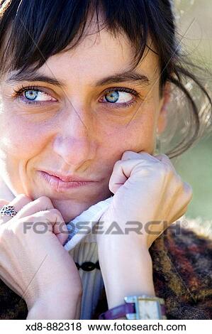 Young woman portrait in a sardonic smile View Large Photo Image Stock Photo - Young woman portrait in a sardonic smile. Fotosearch
