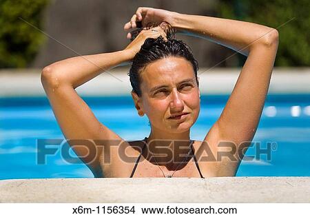 young woman portrait in a swimming pool View Large Photo Image Picture - young woman portrait in a swimming pool. Fotosearch