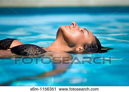 young woman portrait in a swimming pool View Large Photo Image Stock Image - young woman portrait in a swimming pool. Fotosearch