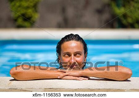 young woman portrait in a swimming pool View Large Photo Image Stock Image - young woman portrait in a swimming pool. Fotosearch