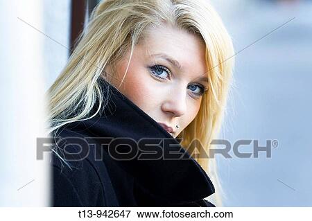 Young woman portrait in Black coat, it's cold View Large Photo Image Stock Photo - Young woman portrait in Black coat, it's cold. Fotosearch