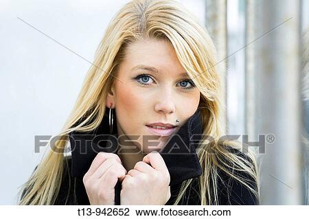 Young woman portrait, it's cold View Large Photo Image Stock Image - Young woman portrait, it's cold. Fotosearch