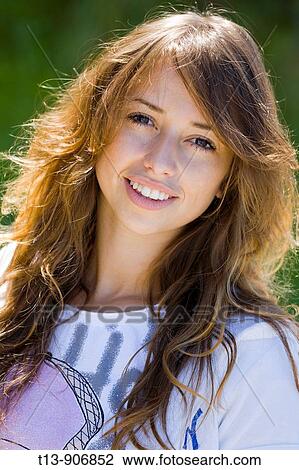 Young woman portrait outdoors View Large Photo Image Stock Image - Young woman portrait outdoors. Fotosearch