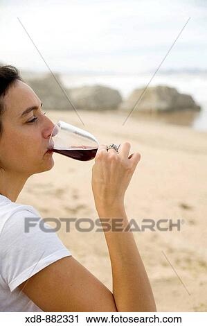 Young woman portrait savouring a wine View Large Photo Image Stock Image - Young woman portrait savouring a wine. Fotosearch
