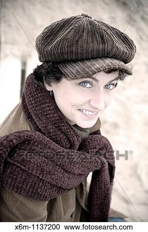 young woman portrait with a cap View Large Photo Image Stock Image - young woman portrait with a cap. Fotosearch