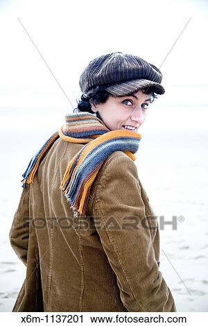 young woman portrait with a cap View Large Photo Image Stock Image - young woman portrait with a cap. Fotosearch