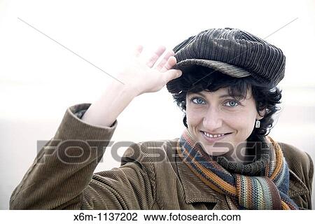 young woman portrait with a cap View Large Photo Image Stock Image - young woman portrait with a cap. Fotosearch