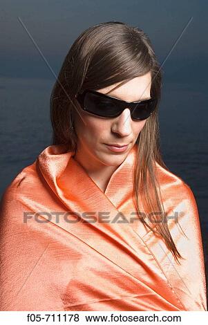 Young woman portrayed on the seashore View Large Photo Image Stock Photo - Young woman portrayed on the seashore. Fotosearch