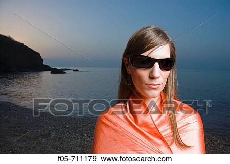 Young woman portrayed on the seashore View Large Photo Image Stock Photo - Young woman portrayed on the seashore. Fotosearch