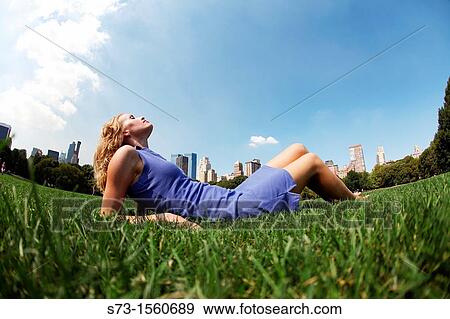 Young woman poses in Central Park, New York, USA View Large Photo Image Stock Photo - Young woman poses in Central Park, New York, USA. Fotosearch
