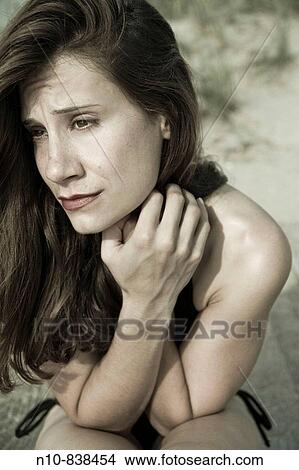 Young woman posing at the beach. View Large Photo Image Picture - Young woman posing at the beach.. Fotosearch