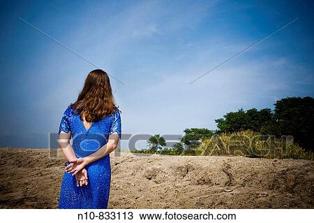 Young woman posing at the beach. View Large Photo Image Stock Image - Young woman posing at the beach.. Fotosearch
