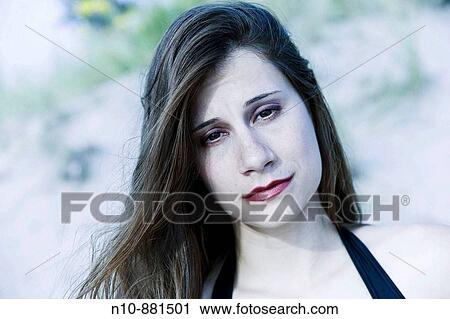 Young woman posing at the beach. View Large Photo Image Stock Image - Young woman posing at the beach.. Fotosearch