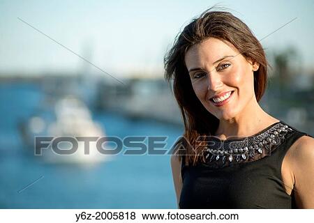 Young woman posing for photo. View Large Photo Image Stock Photo - Young woman posing for photo.. Fotosearch