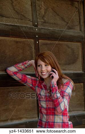 Stock Image - Young Woman Posing in Casual Clothes. Fotosearch