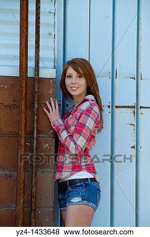 Stock Photo - Young Woman Posing in Casual Clothes. Fotosearch