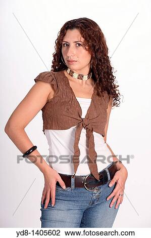 Young woman posing in studio View Large Photo Image Stock Image - Young woman posing in studio. Fotosearch