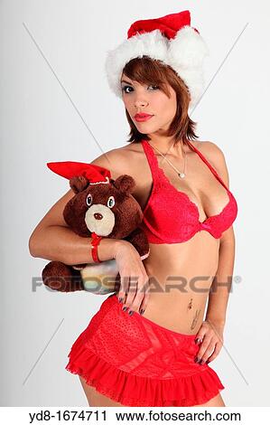Stock Image - Young woman posing in the Studio. Fotosearch