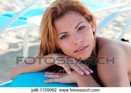 Young woman posing looking at the camera View Large Photo Image Stock Image - Young woman posing looking at the camera. Fotosearch