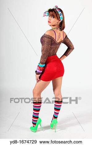Young woman posing sideways in the Studio View Large Photo Image Stock Photo - Young woman posing sideways in the Studio. Fotosearch