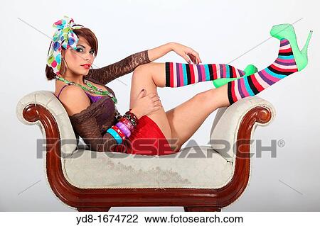 Young woman posing sitting in the Studio View Large Photo Image Stock Image - Young woman posing sitting in the Studio. Fotosearch