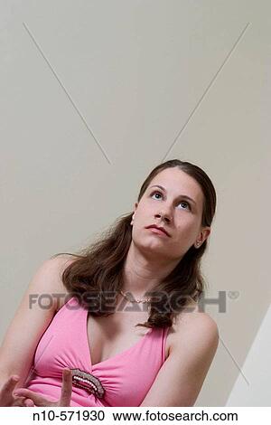 Young woman posing View Large Photo Image Stock Image - Young woman posing. Fotosearch
