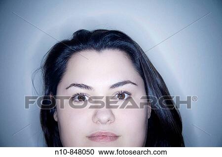 Stock Image - Young woman posing. Fotosearch