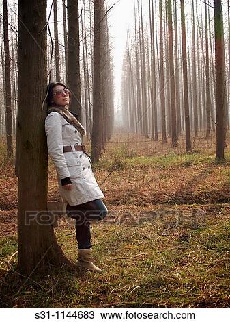 Stock Image - young woman posing. Fotosearch
