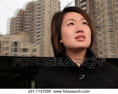 Stock Image - young woman posing. Fotosearch