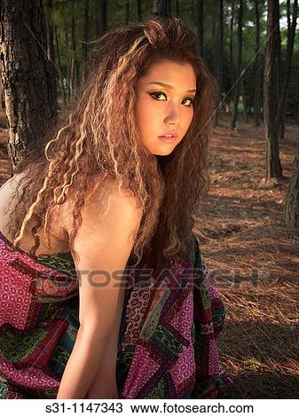 Stock Image - Young woman posing. Fotosearch
