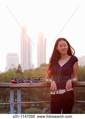 Stock Image - young woman posing. Fotosearch