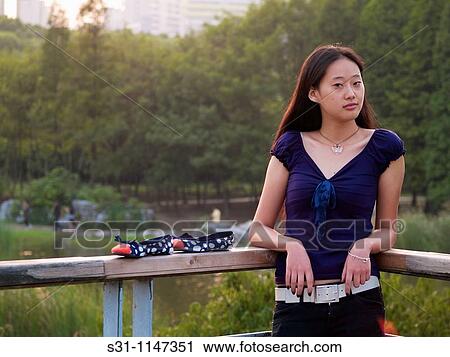 Stock Image - young woman posing. Fotosearch