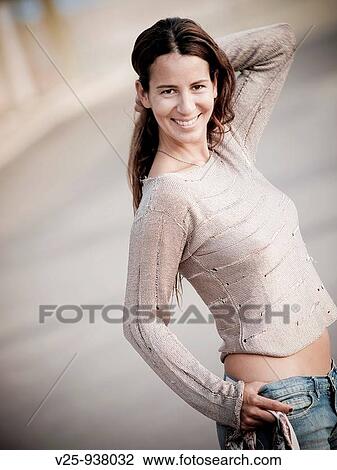 Young woman posing View Large Photo Image Stock Image - Young woman posing. Fotosearch