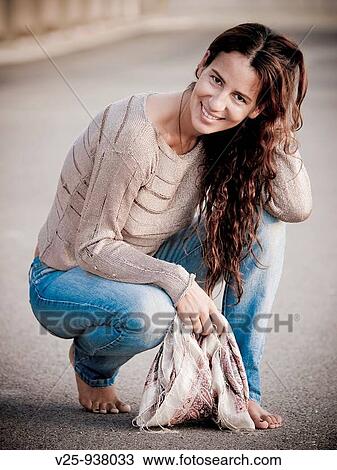 Stock Image - Young woman posing. Fotosearch