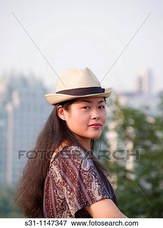 Stock Photo - young woman posing. Fotosearch