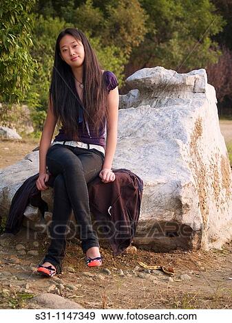 Stock Photo - young woman posing. Fotosearch